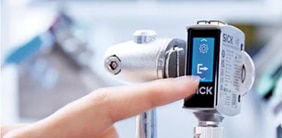 Finger touching a sensor interface