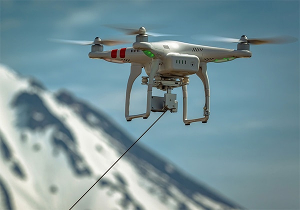 Drones can stay aloft for long periods using power supplied via a tether Image of drones can stay aloft for long periods using power supplied via a tether
