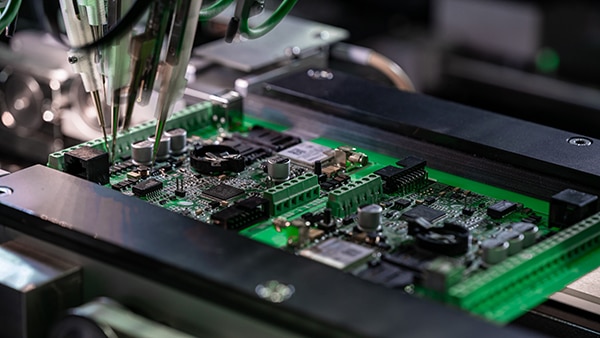 Automated soldering of chip components onto a PCB Image of automated soldering of chip components onto a PCB