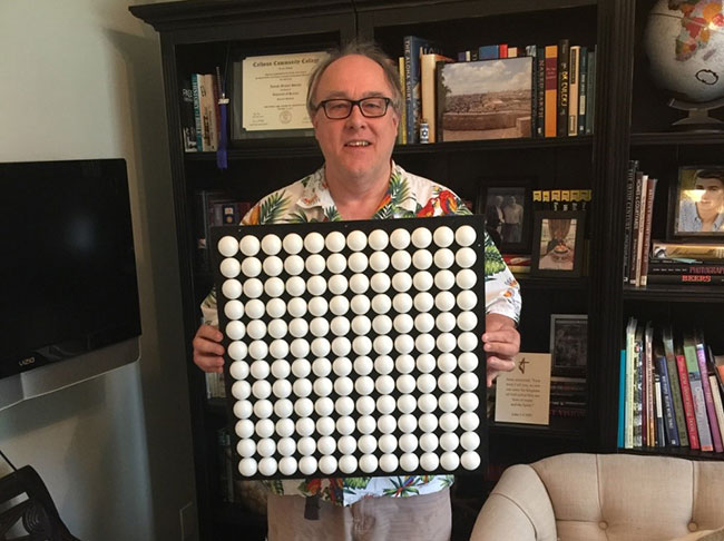 Max Maxfield proudly holding his 12 x 12 array of ping pong balls, each containing a tricolor LED