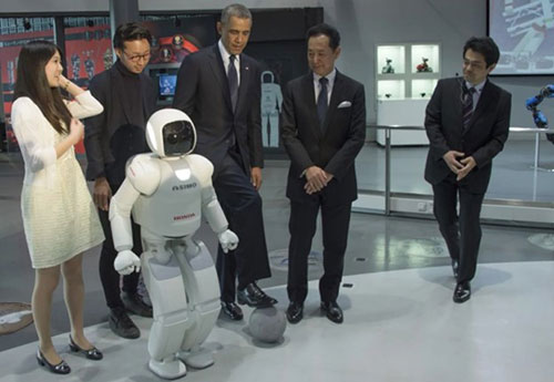 ASIMO playing football with Barack Obama