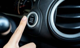 A close up of the Automotive Start Stop button in the dashboard